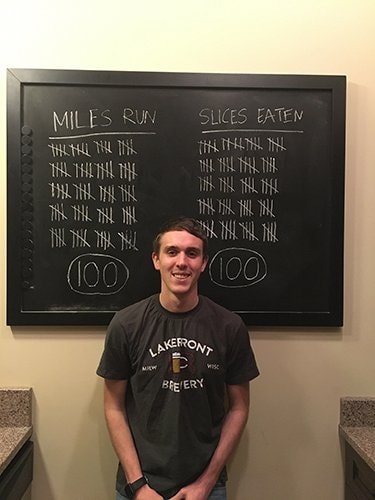 Final tally of pizza and miles on chalkboard