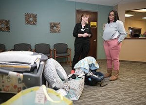 Christina Bailey, MA, and Tiana Banks chat while Raymond naps