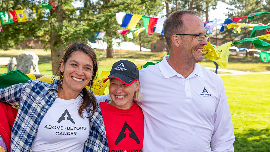 family smiling outside